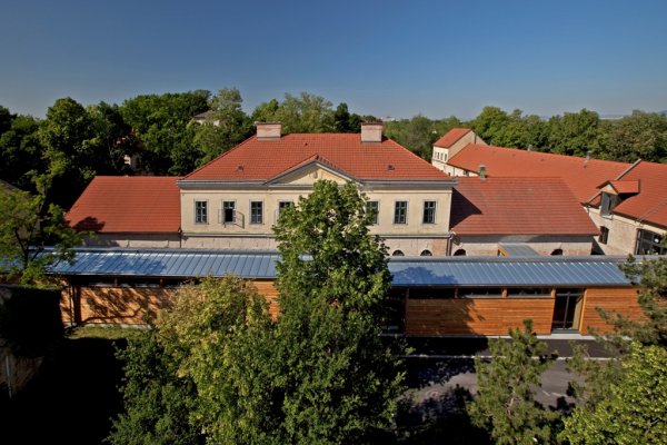 The former caretaker’s lodge with new wooden additions.